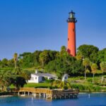 An picture of the Jupiter Inlet Lighthouse ONA which includes Jupiter Inlet Lighthouse, pedestrian pier, and Loxahatchee River.